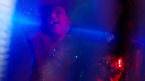 Close-Up-Of-Two-Women-In-Nightclub-Bar-Or-Disco-Dancing-With-Sparkling-Lights-5